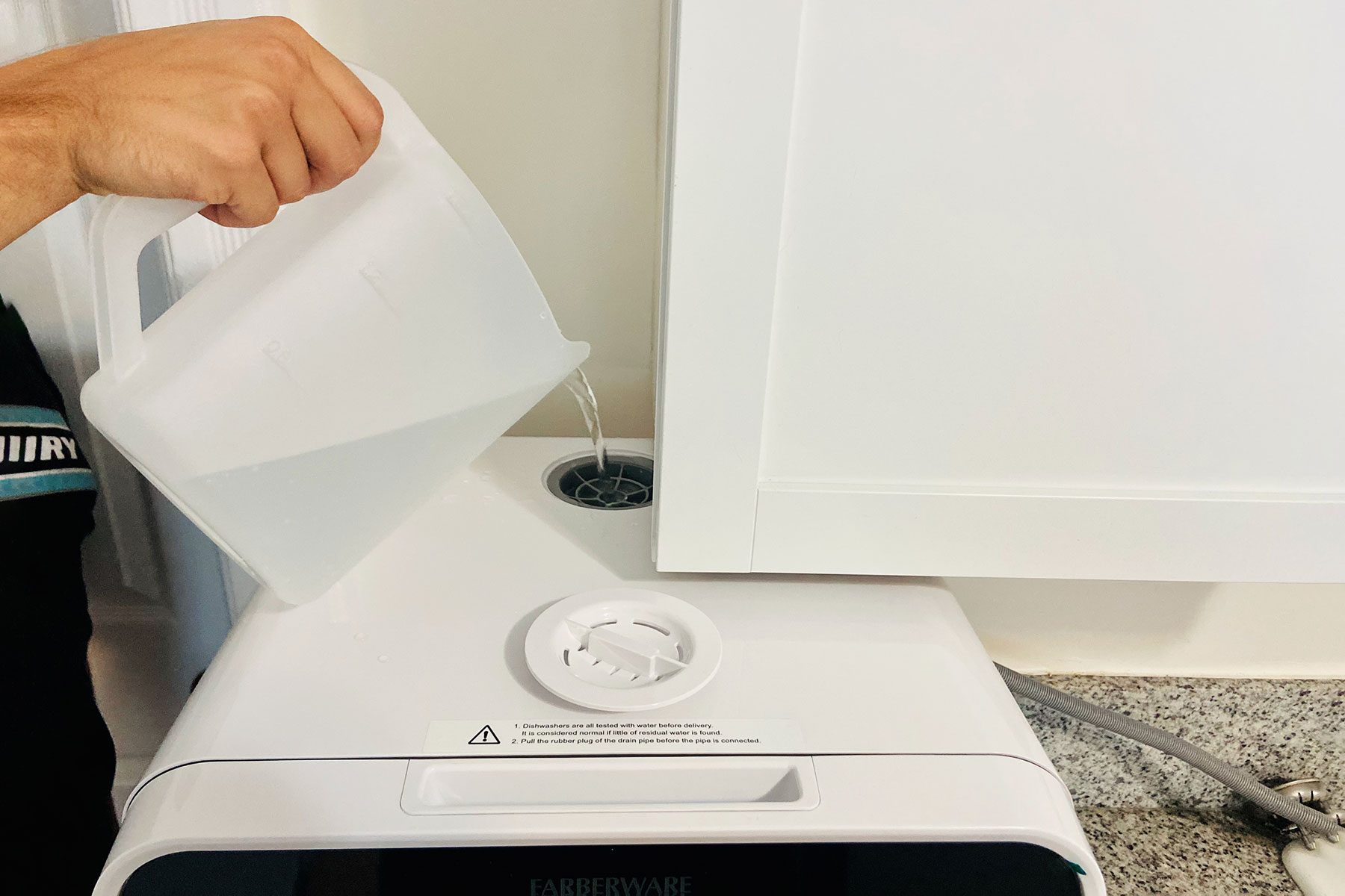 Pouring Water in Farberware Countertop Dishwasher