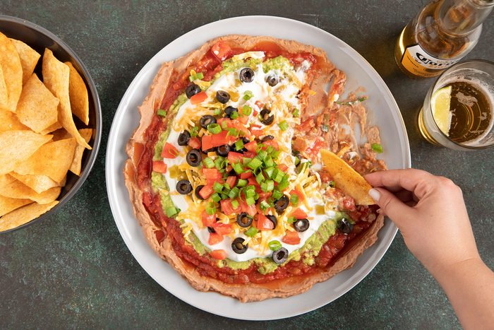 Dip on plate with chips and beer