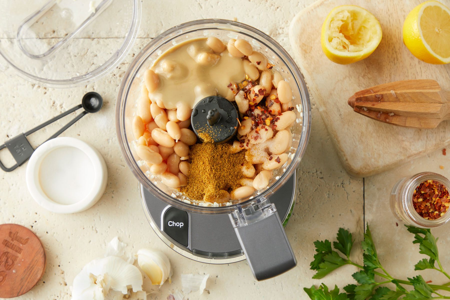 drained beans, tahini, lemon juice, cumin, salt and pepper flakes mixed in a blender