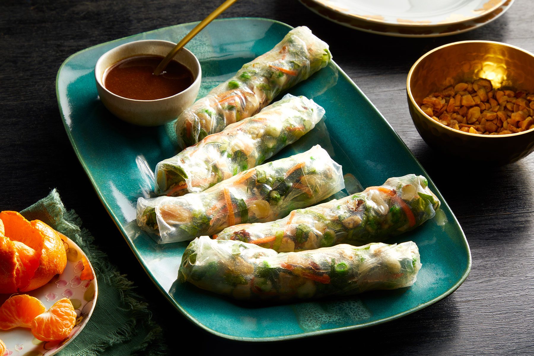 Fresh Spring Rolls served on blue plate with sauce