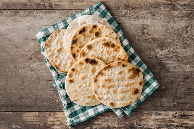 Handmade Matzah Matzo For Jewish Passover On Wooden Table
