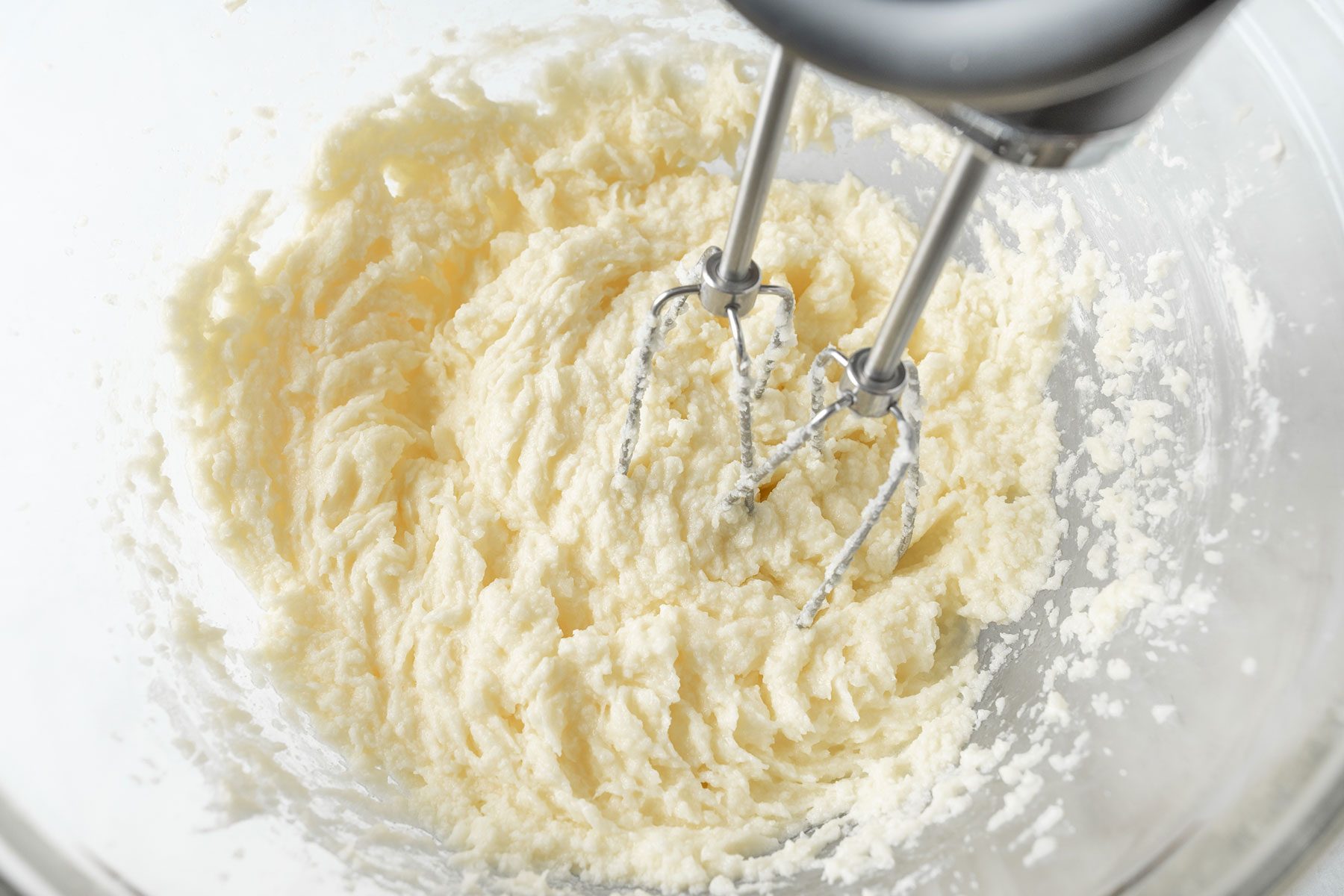 Mixing ingredients with stand mixer in a large bowl