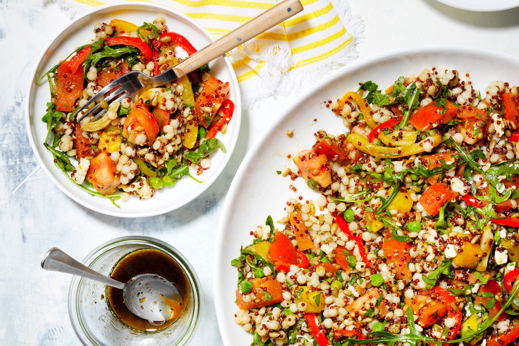 Summer Salad served in plate with fork, laced on a countertop