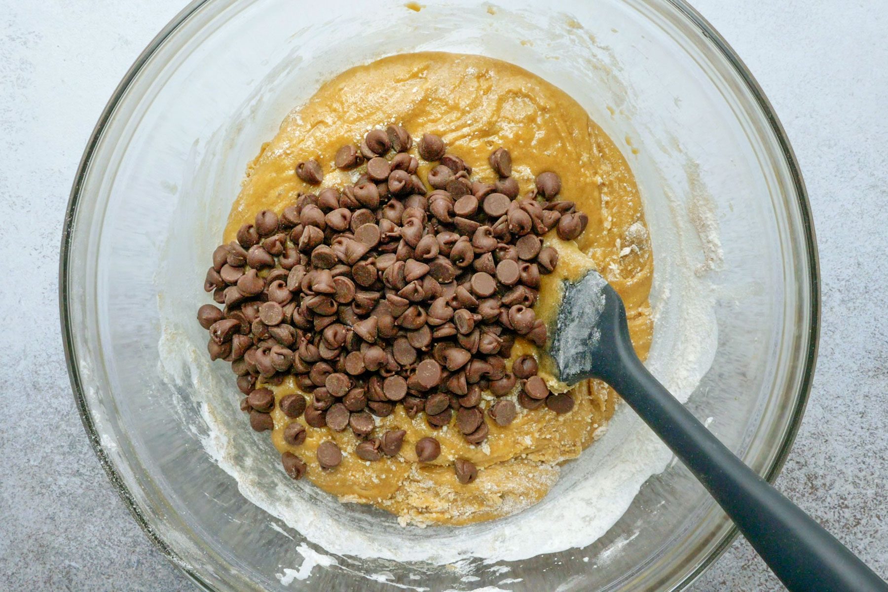 Folding the chocolate chips in a bowl