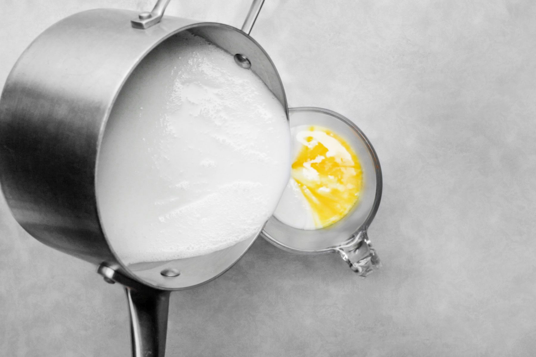 Pouring milk mixture in egg mixture