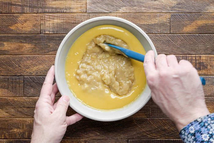 Whisking together the flour, sugar with a spatula in a large bowl