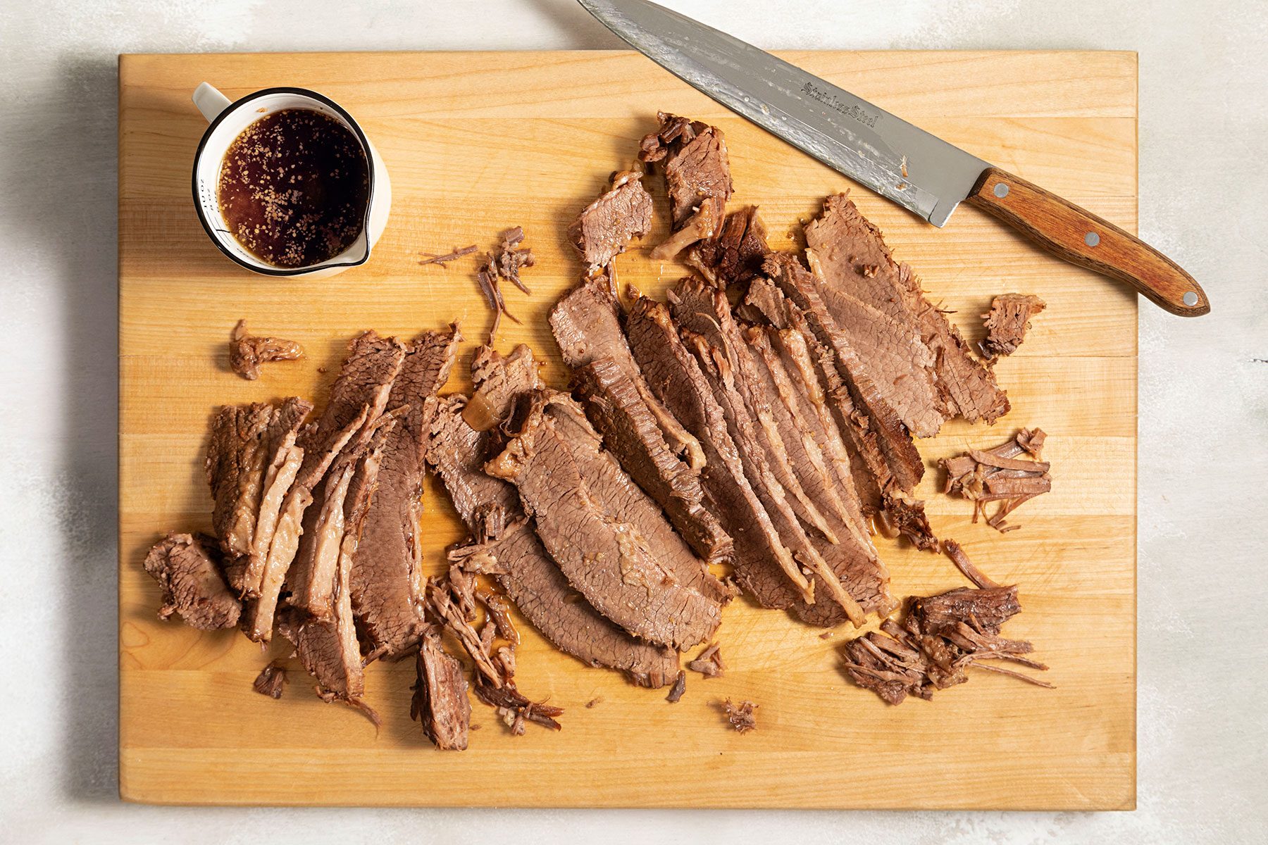 Sliced Brisket on wooden chopping board