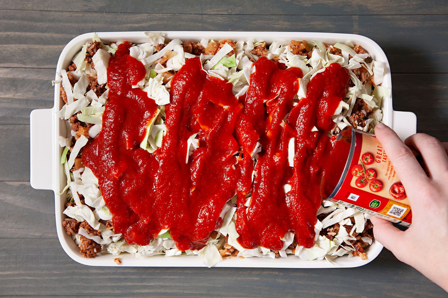 Topping off with tomato sauce 