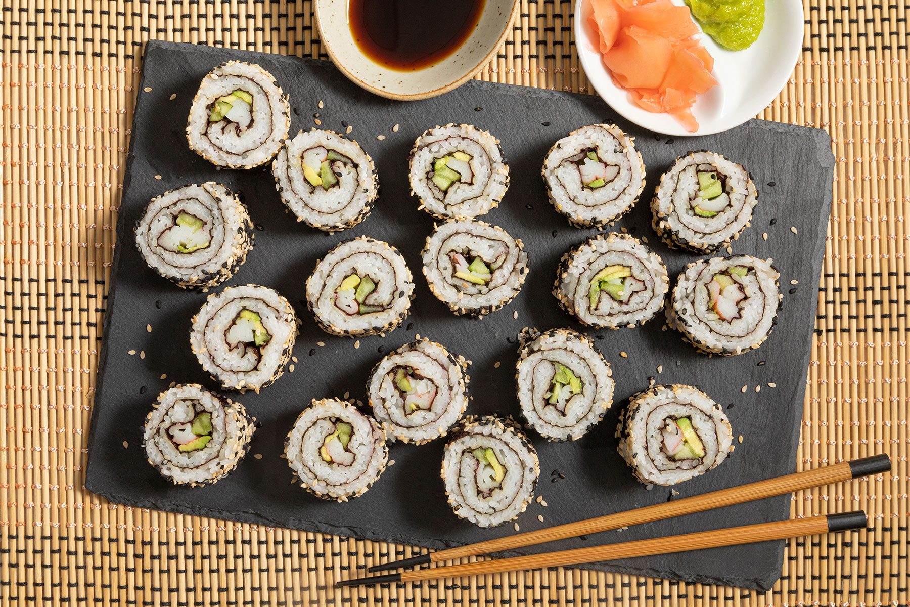 California Roll served with wasabi and soy sauce with chopsticks 