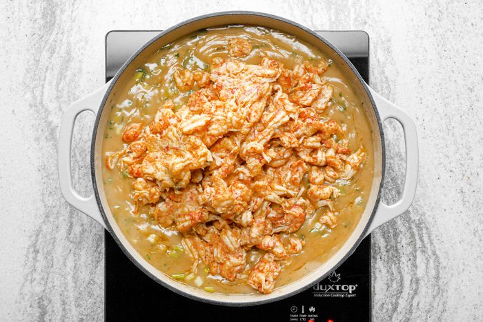 Remove bayleaf and then stir crawfish in the skillet