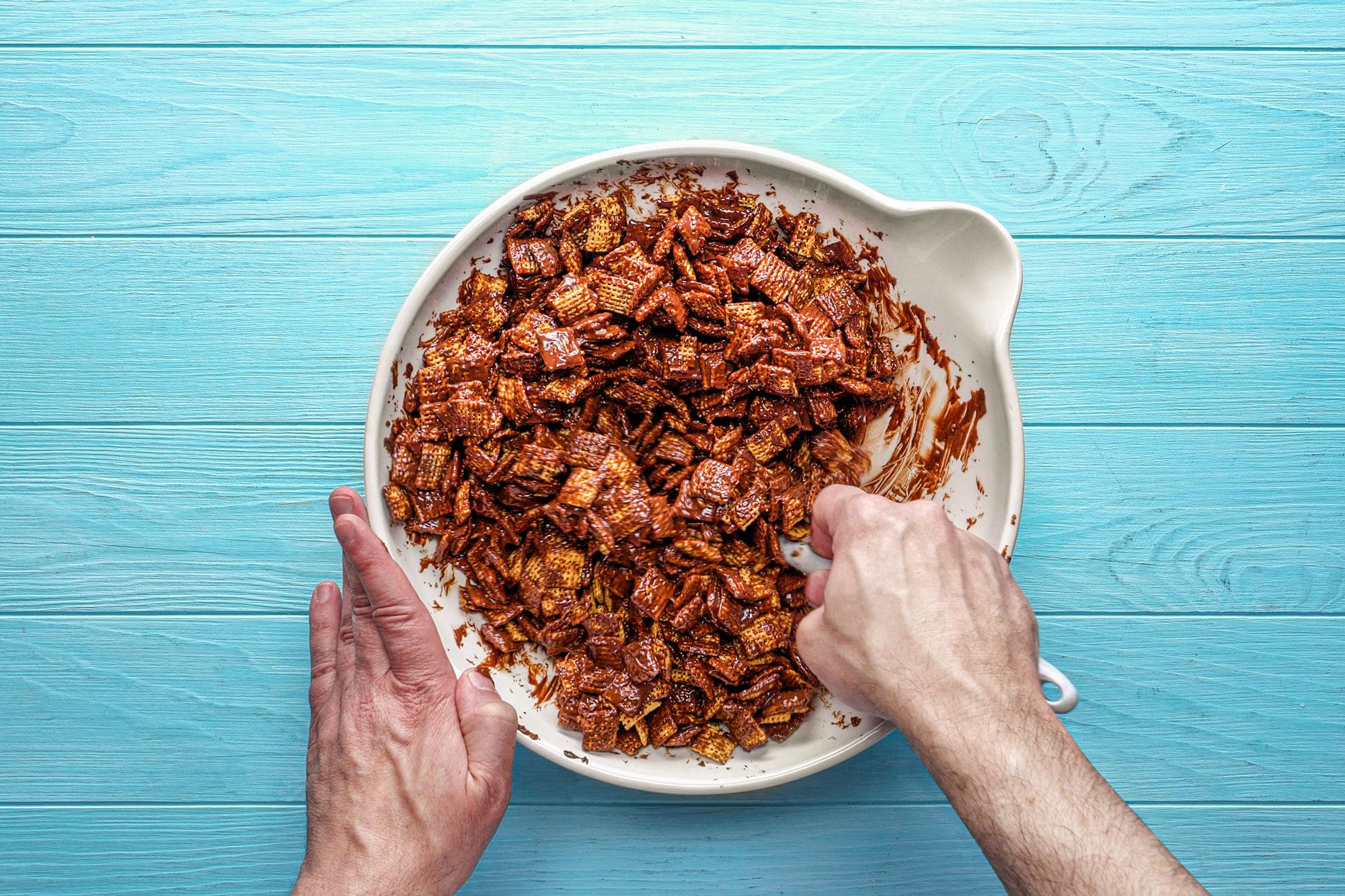 Gently stir with a spatula to coat the Chex