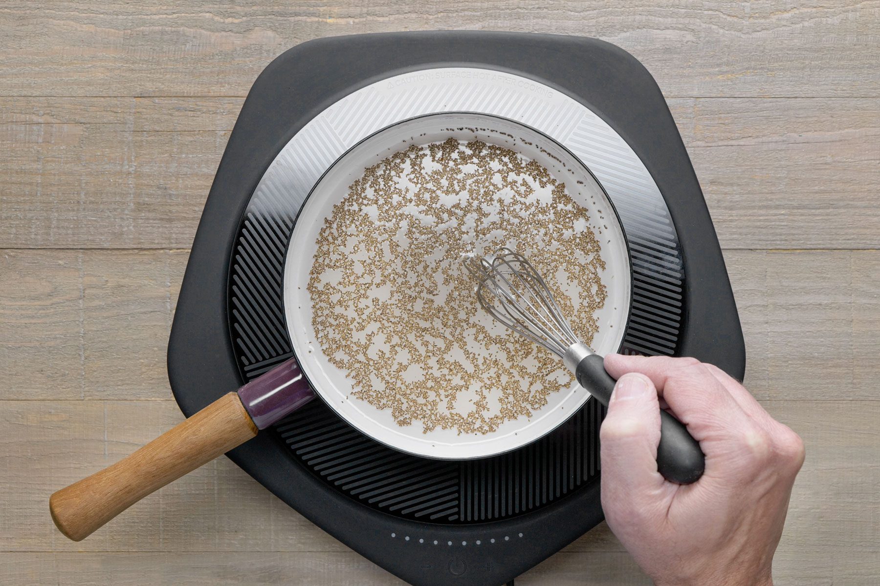 whisking together the sugar, vinegar, celery seed in a sauce pan
