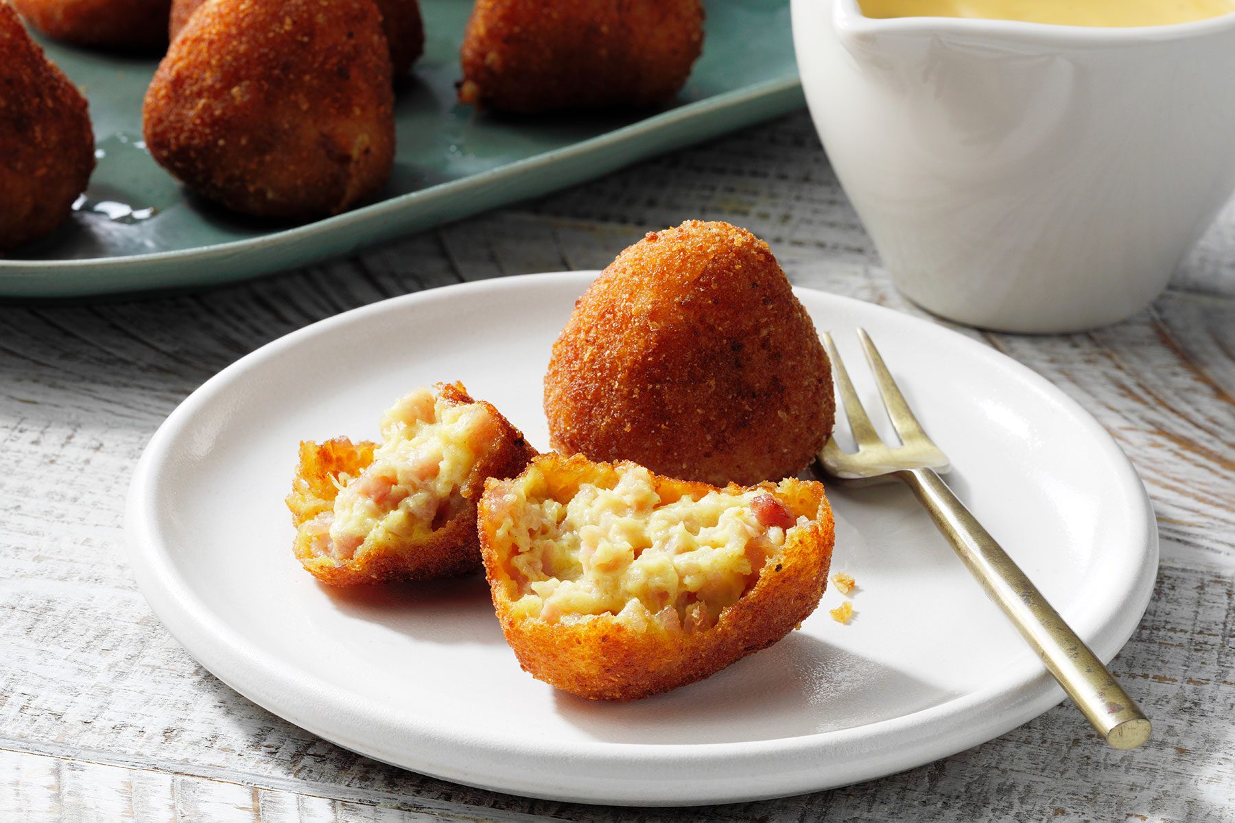 Ham Croquettes served on plate with melted cheese