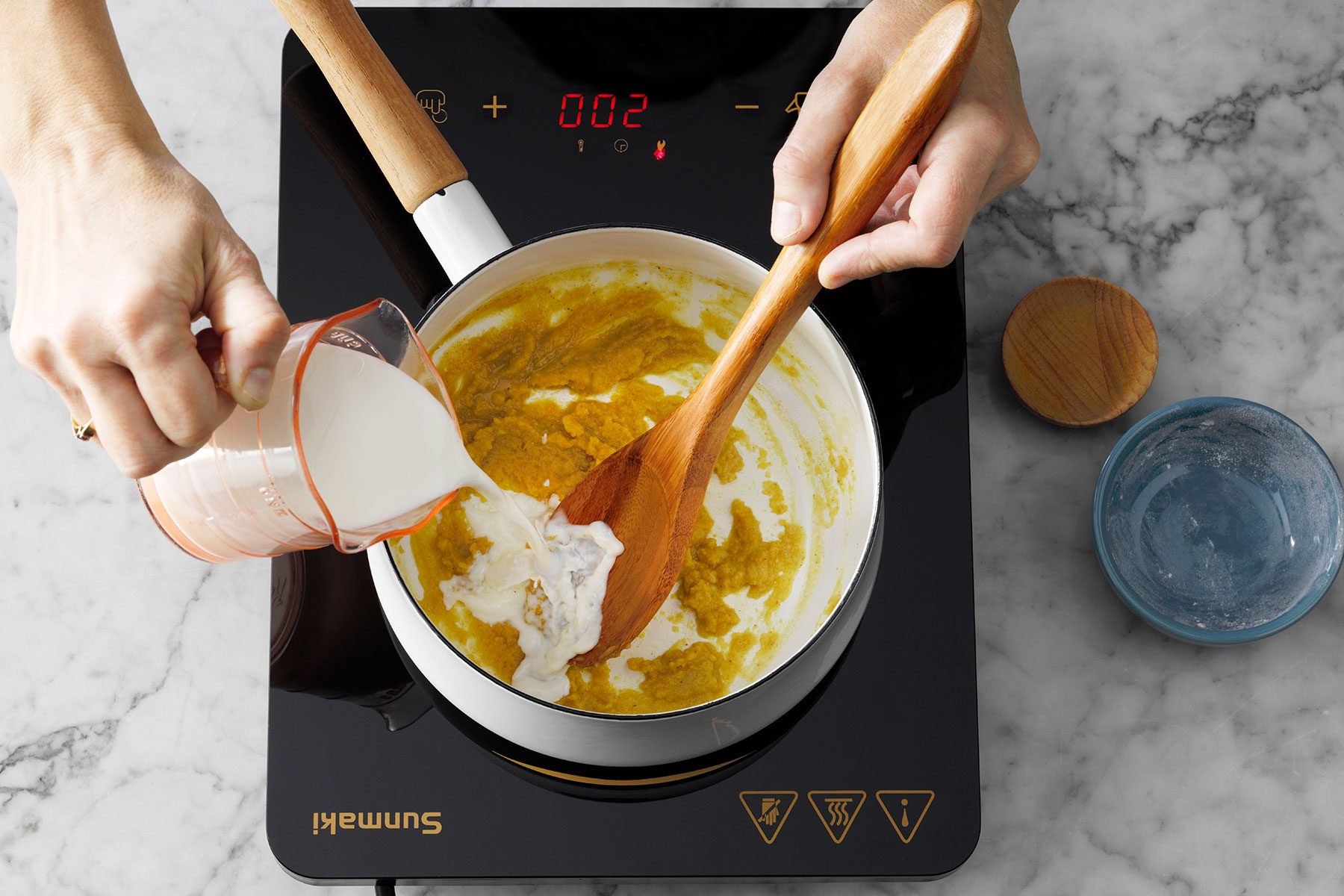 Adding Milk to mixture in saucepan