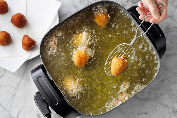 Frying ham balls in large skillet