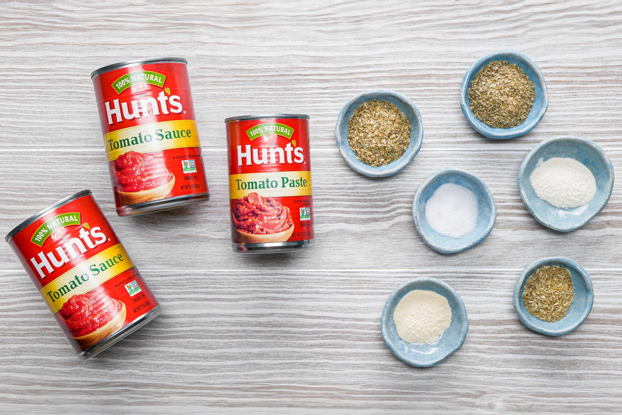 All Ingredients for Homemade Pizza Sauce on Wooden Surface