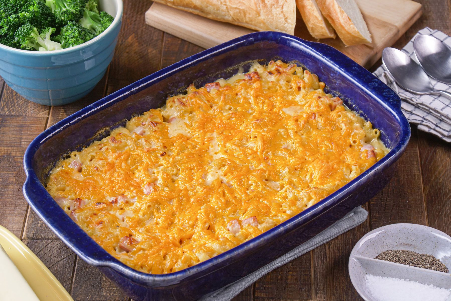Mac And Cheese With Ham in a baking dish on a wooden table
