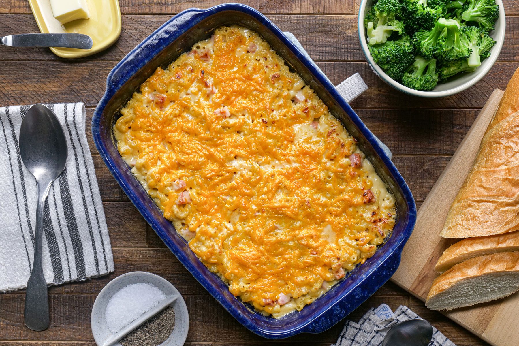 Mac And Cheese With Ham served in a baking dish with pieces of bread