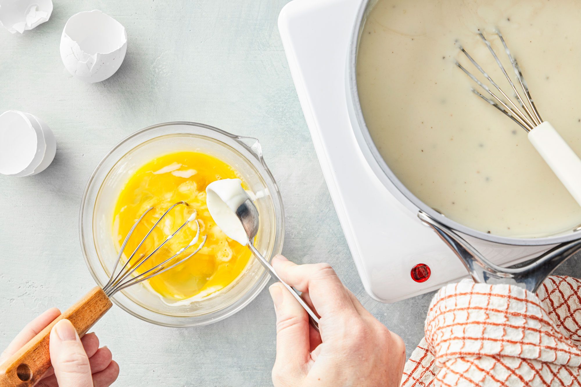 Whisk a small amount of hot mixture into eggs in a small bowl