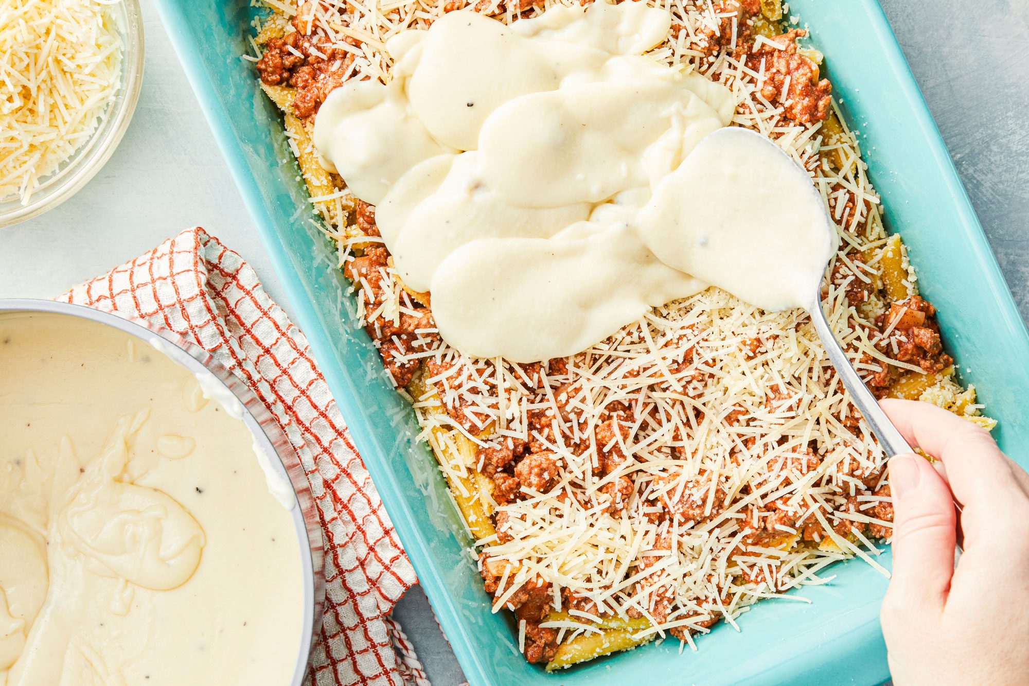 Pour bechamel sauce over beef mixture