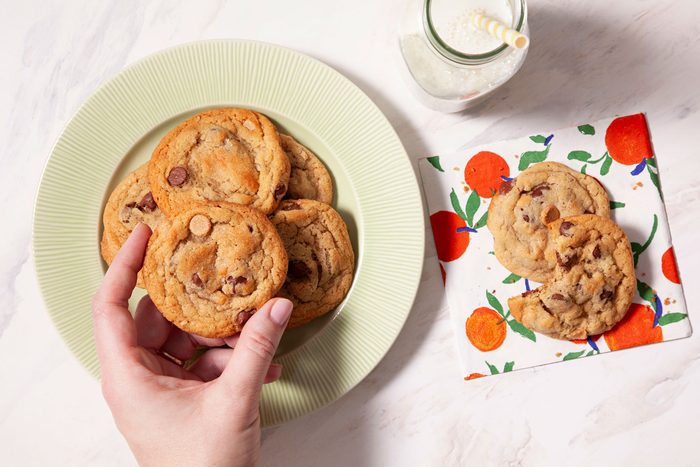 Peanut Butter Oatmeal Chip Cookies served in a small plate with a glass of milk