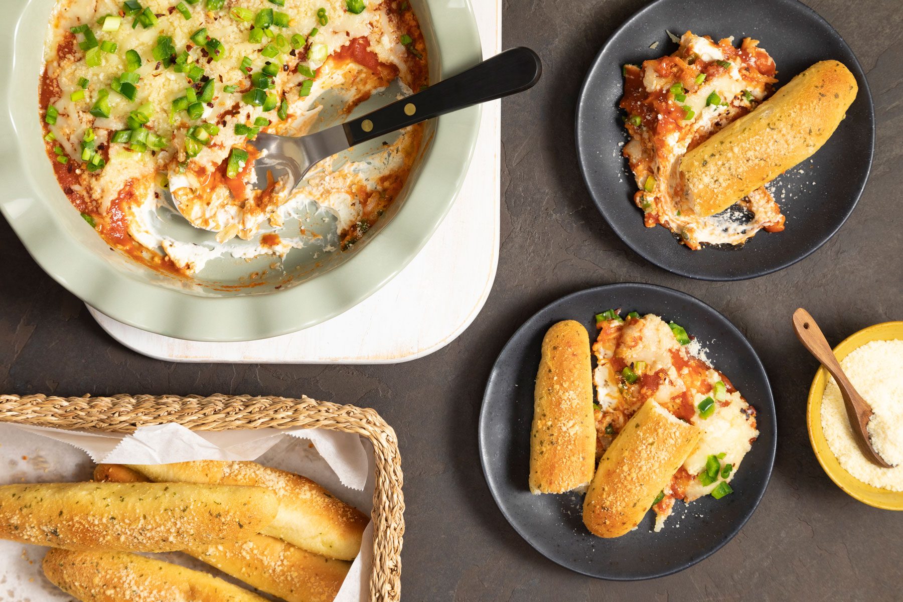 Pizza Dip served in plates with pieces of bread