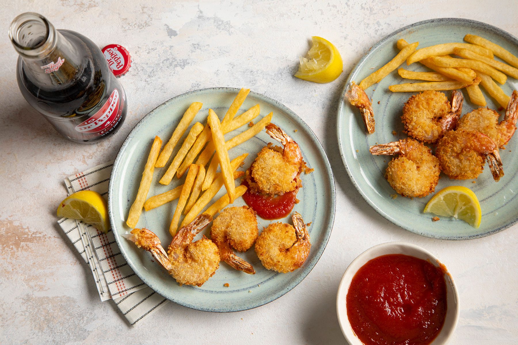 Air Fryer Popcorn Shrimp served with fries and cocktail