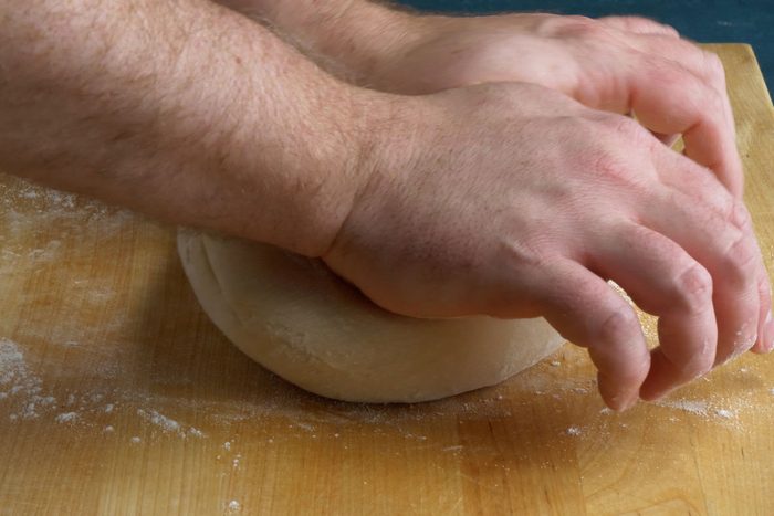 Knead the dough on floured surface