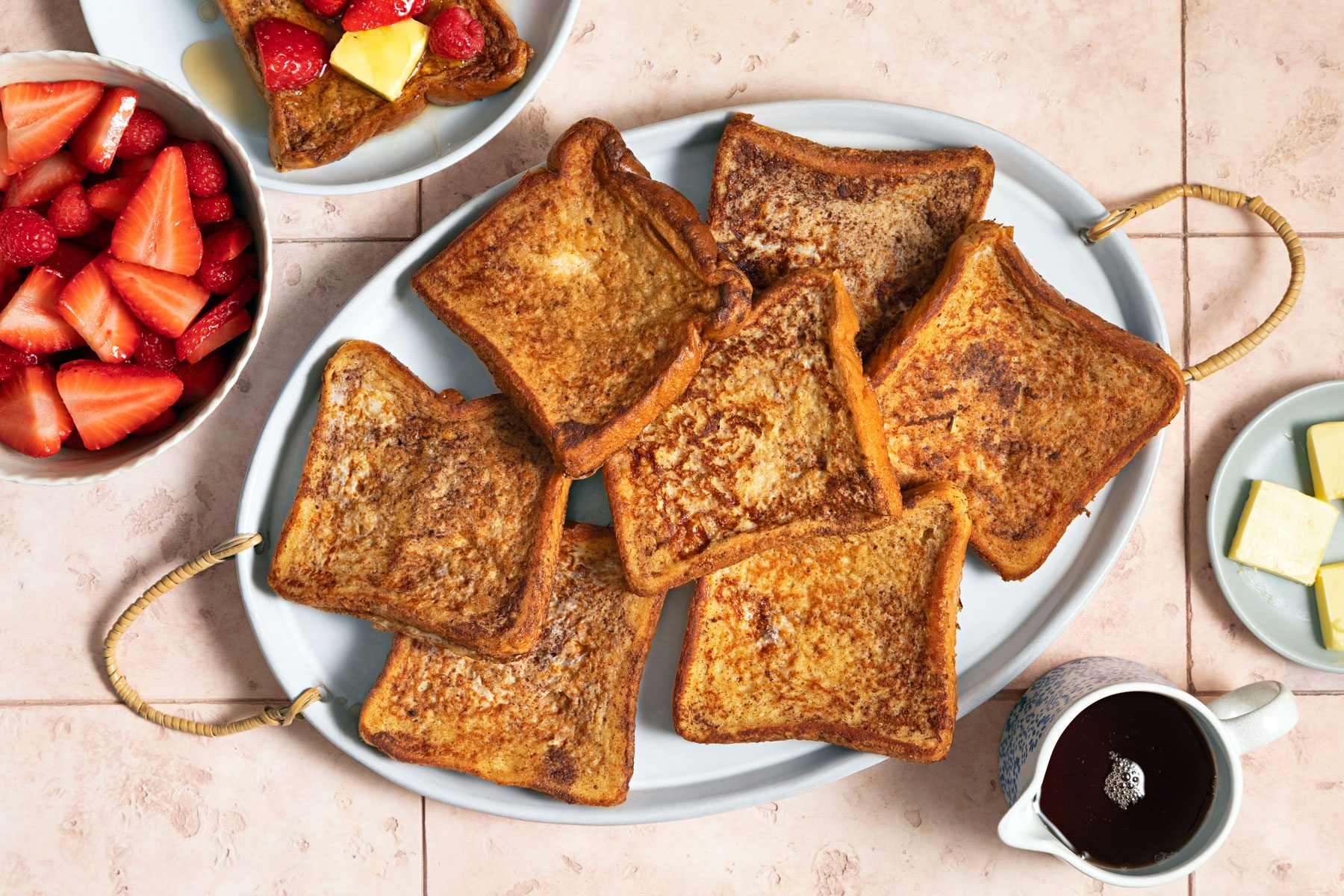 Cinnamon French in a plate served with coffee and straberries