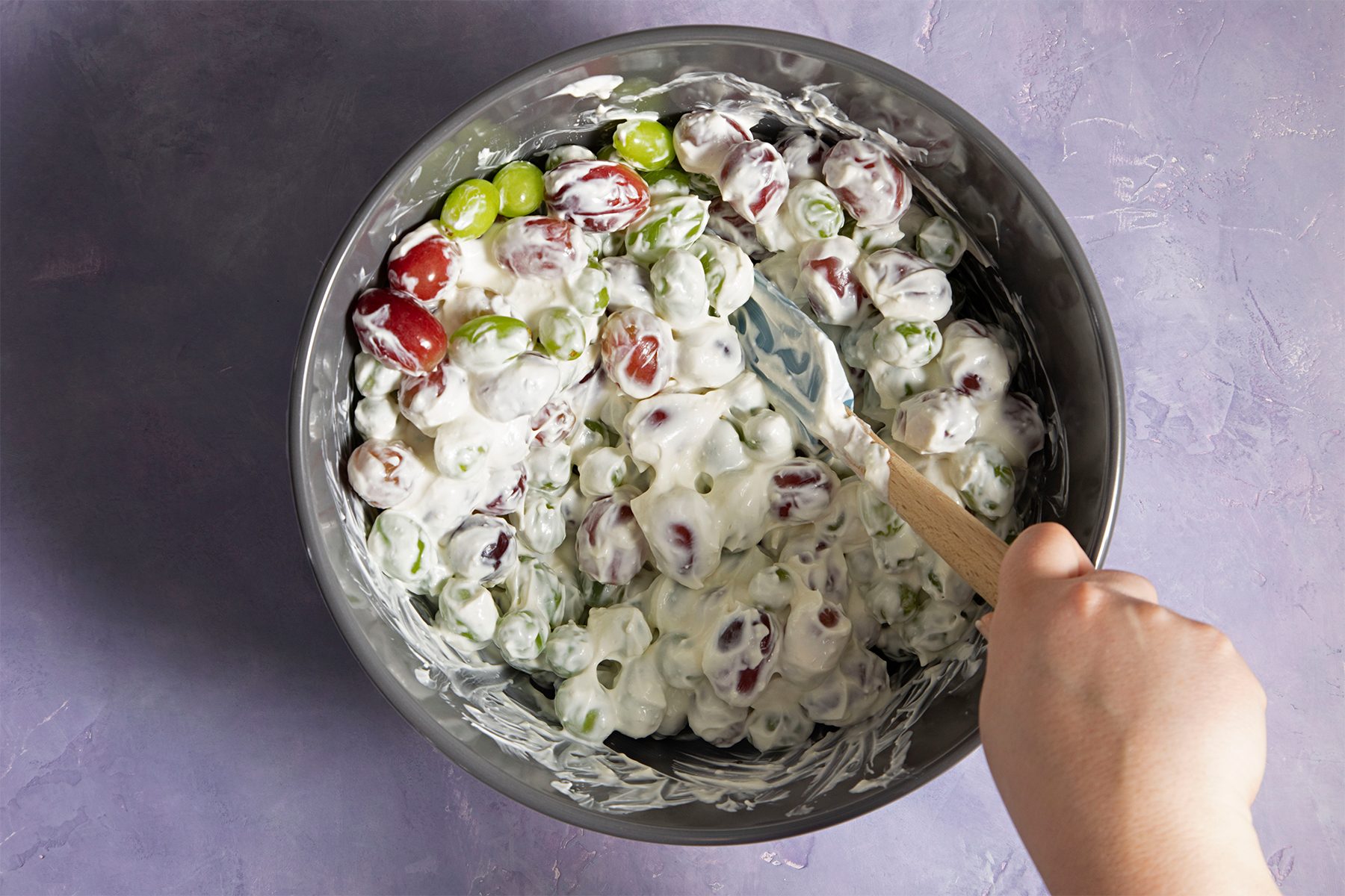 tossing the grapes for Creamy Grape Salad