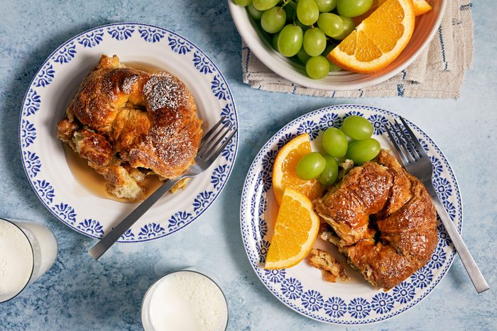 Delicious Croissant French Toast Bake served in plate with fruits