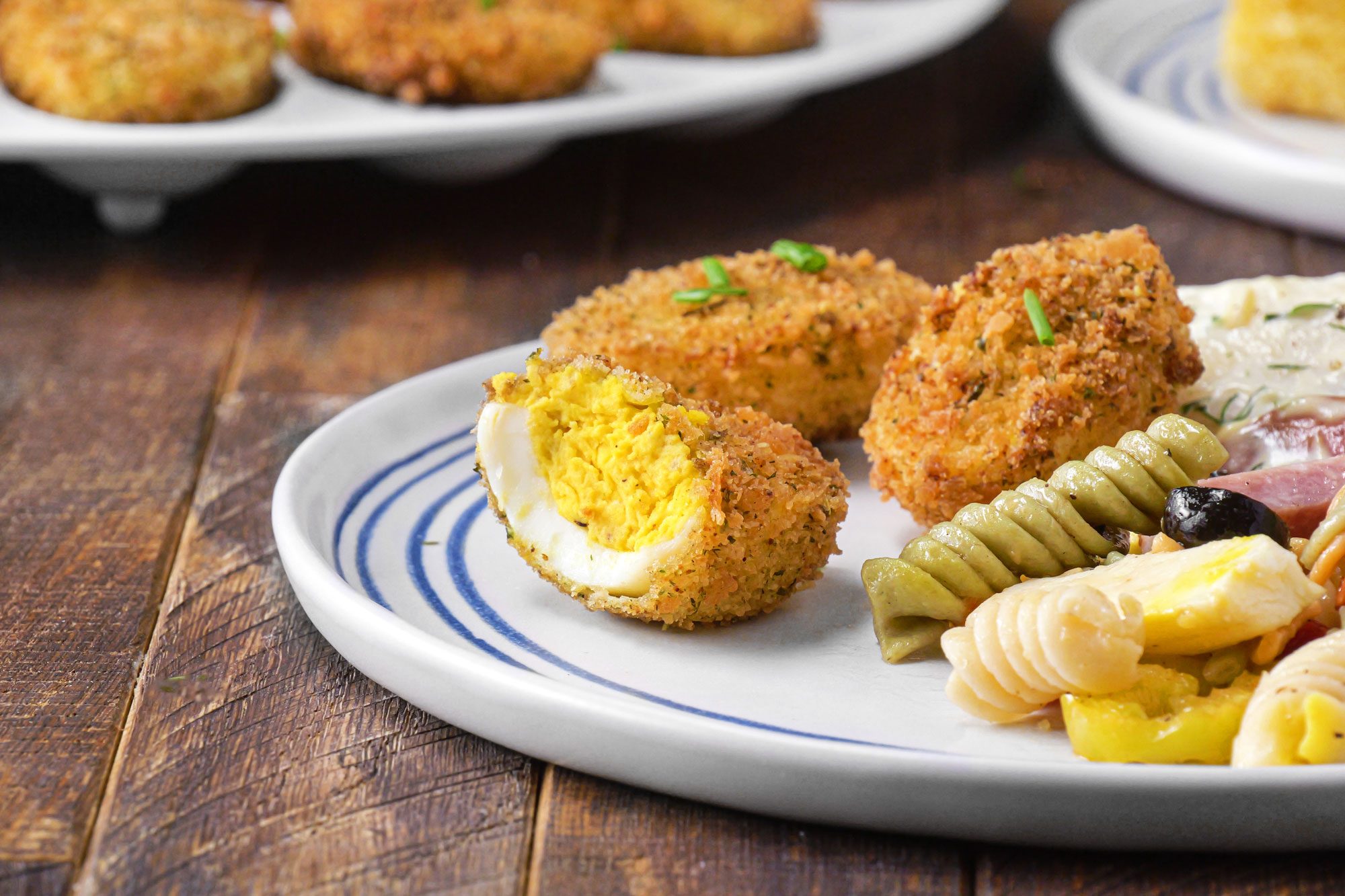 A plate of Deep-Fried Deviled Eggs placed on a table