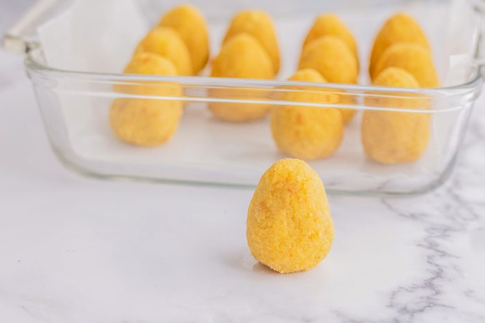 Place the egg shaped cake into a dish