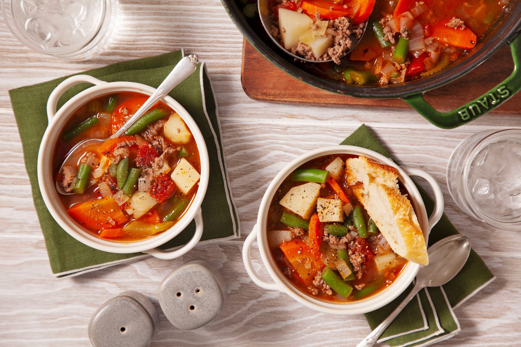 Hamburger Soup served in small bowls with bread.