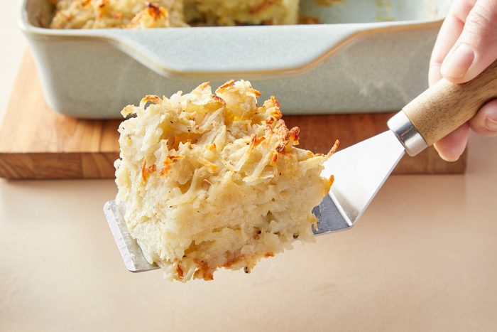 A piece of potato kugel on a spatula