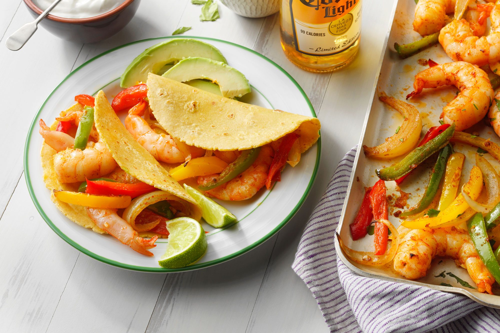 Delicious plate of shrimp and tortilla paired with a refreshing bottle of beer