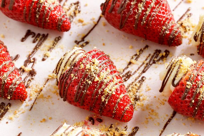 Overhead shot of Strawberry Cheesecake Bites with drizzled chocolate