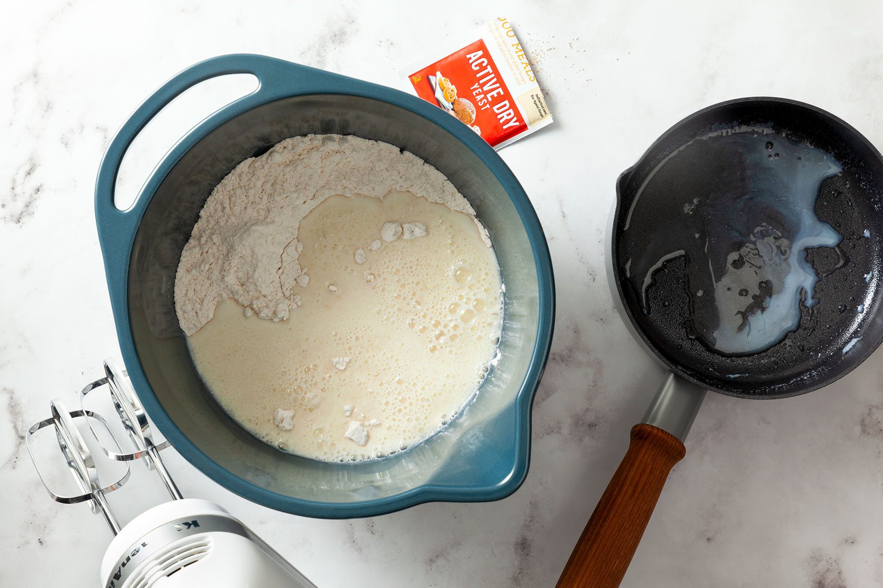 flour and yeast in large bowl Whisking machine on the side 