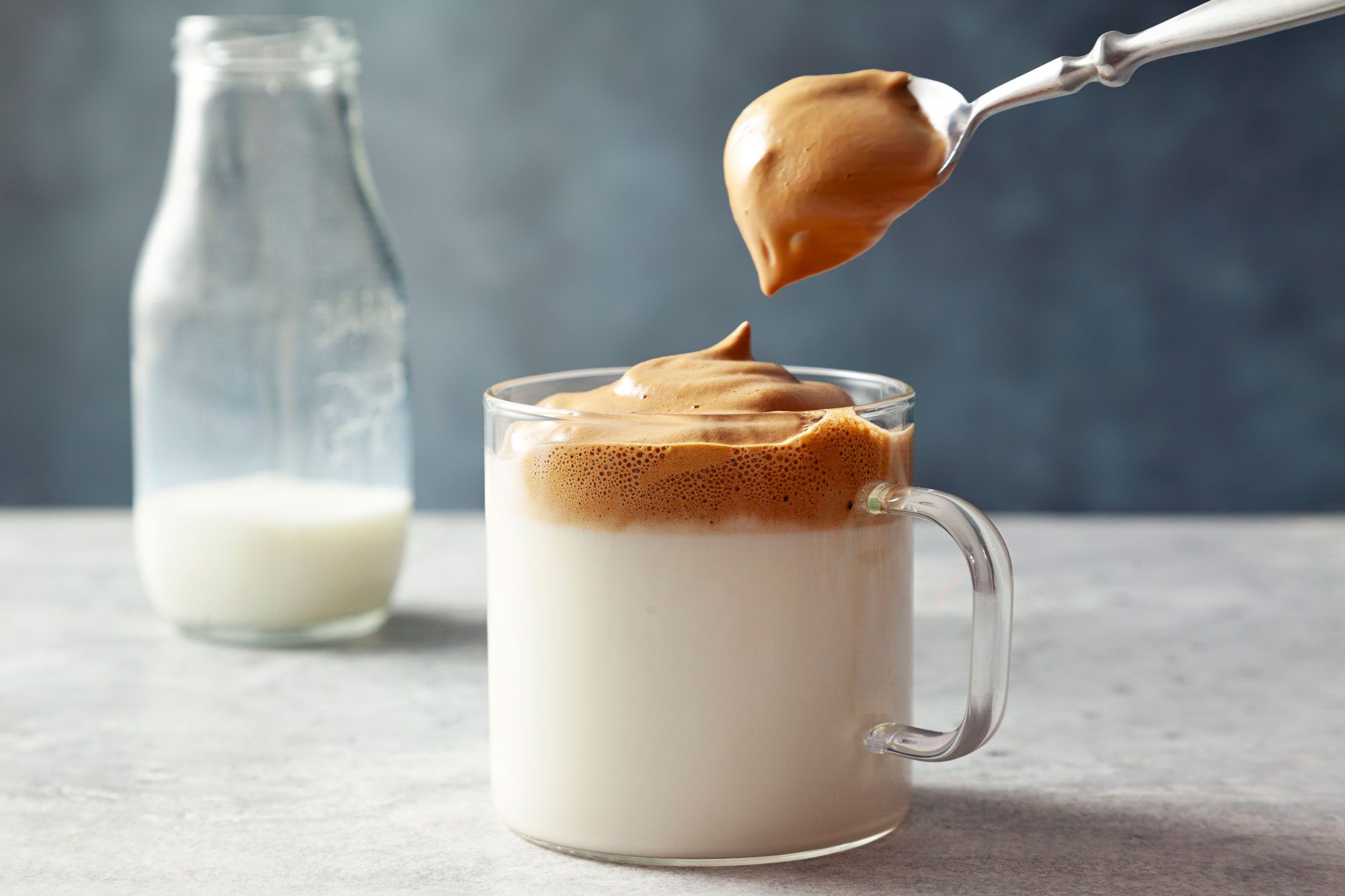 wide shot of milk topped with coffee mixture
