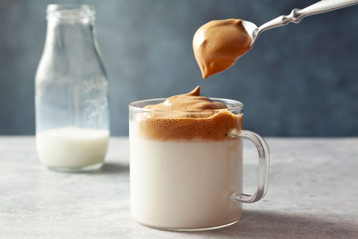 wide shot of milk topped with coffee mixture