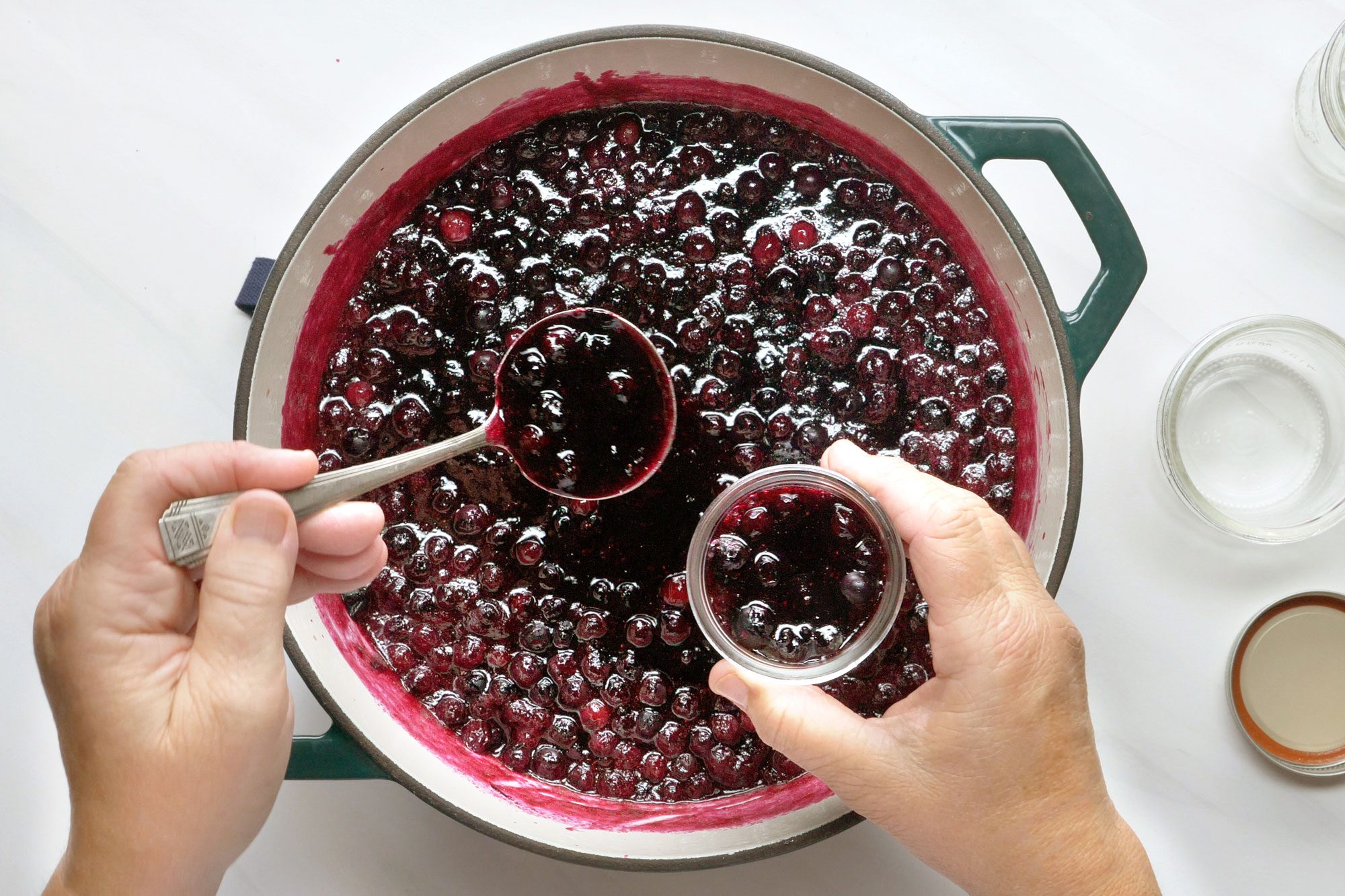 overhead shot of prepared blueberry mix transferred in small jars