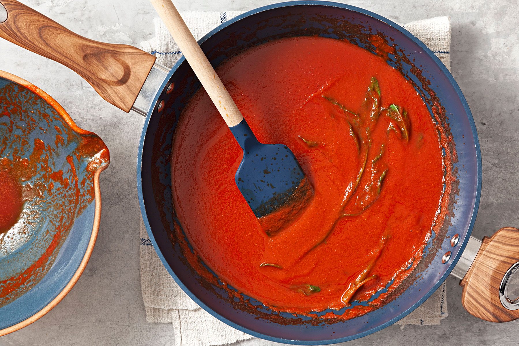 Stirring sauce in pan over heat