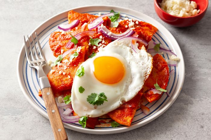 Chilaquiles served on plate with fork