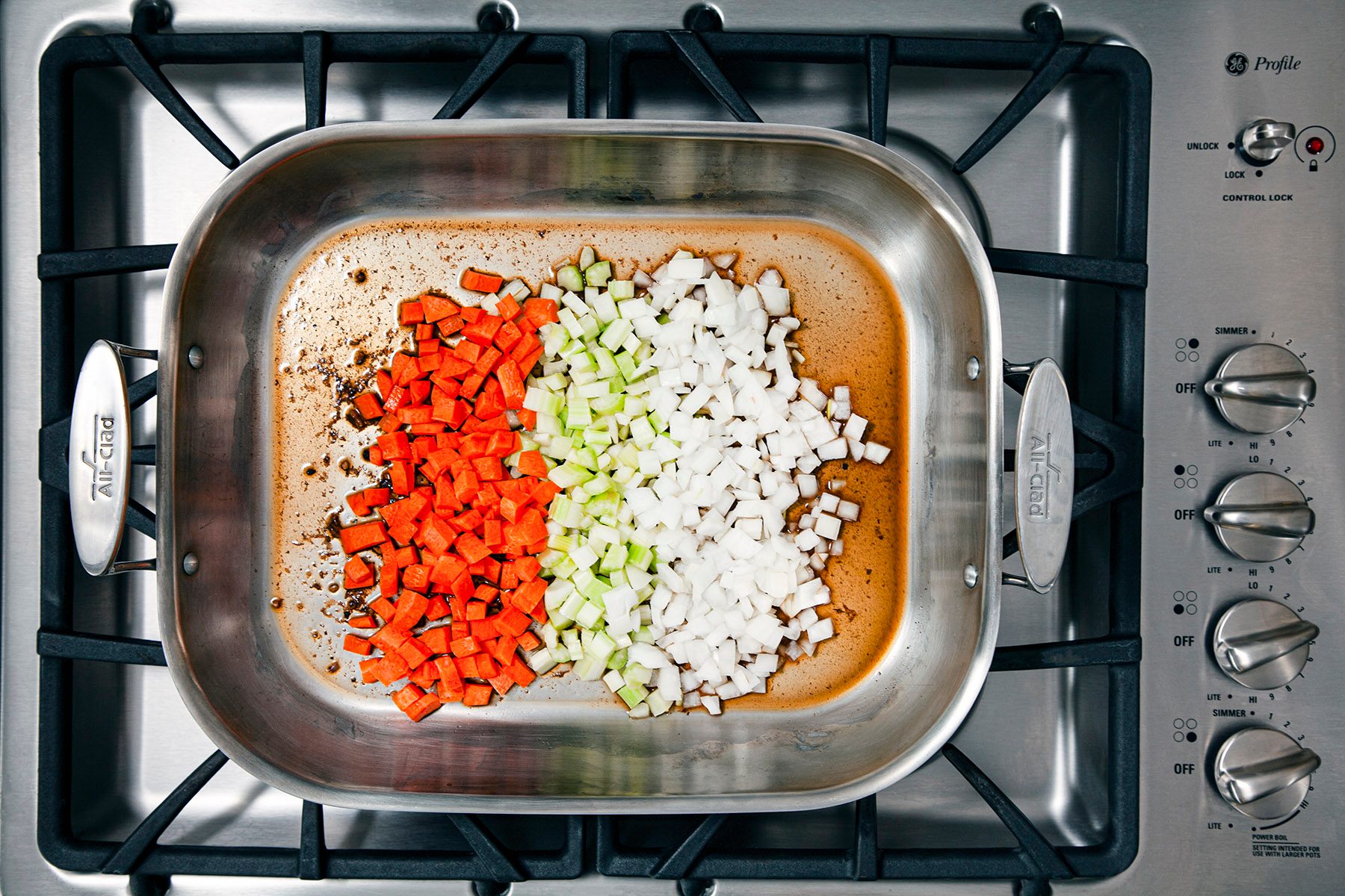 Overhead shot of roasting pan cooking veggies