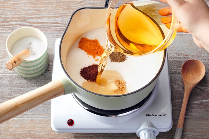 high angle shot of easy refrigerator pickles ingredients mixing in the large sauce pan