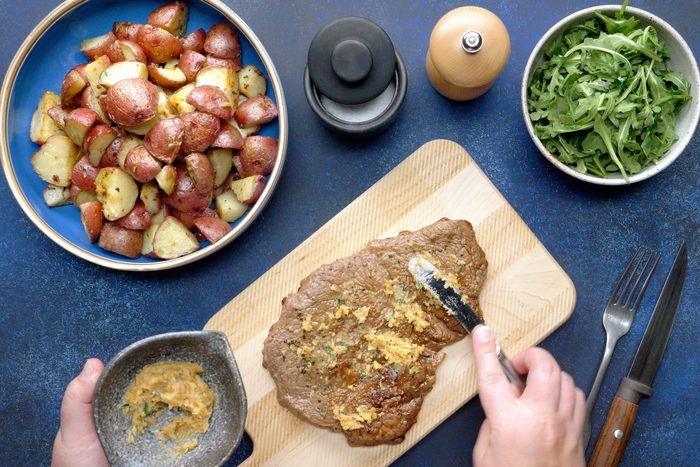 Top the steak with the garlic butter