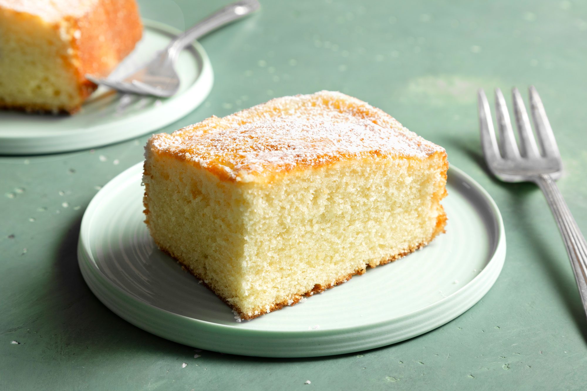 Hot Milk Cake served in two plates with fork