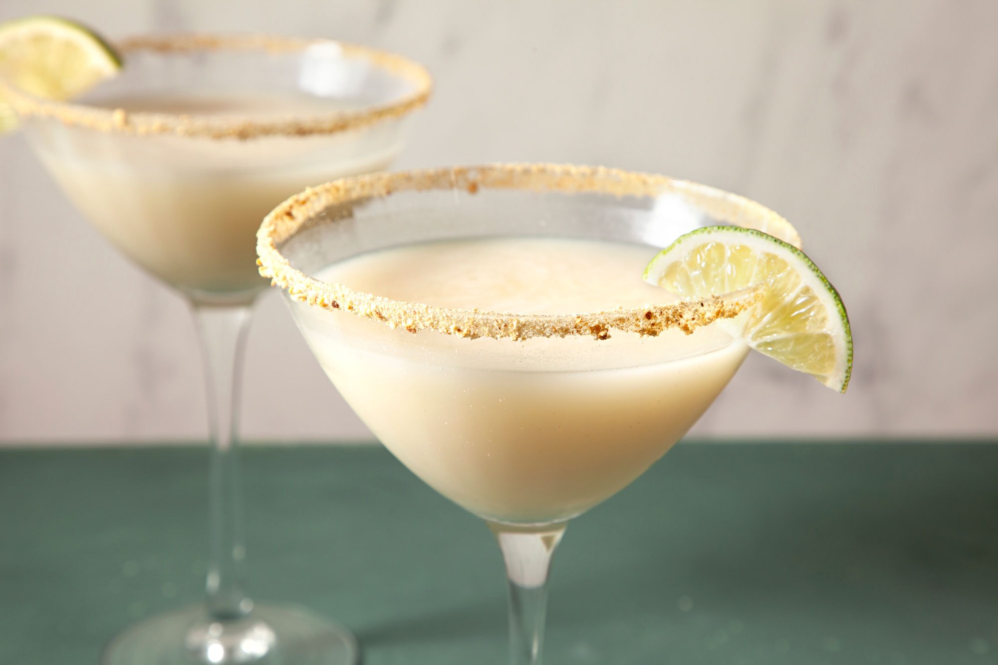 Straight Shot of Key Lime Martini; Green background;