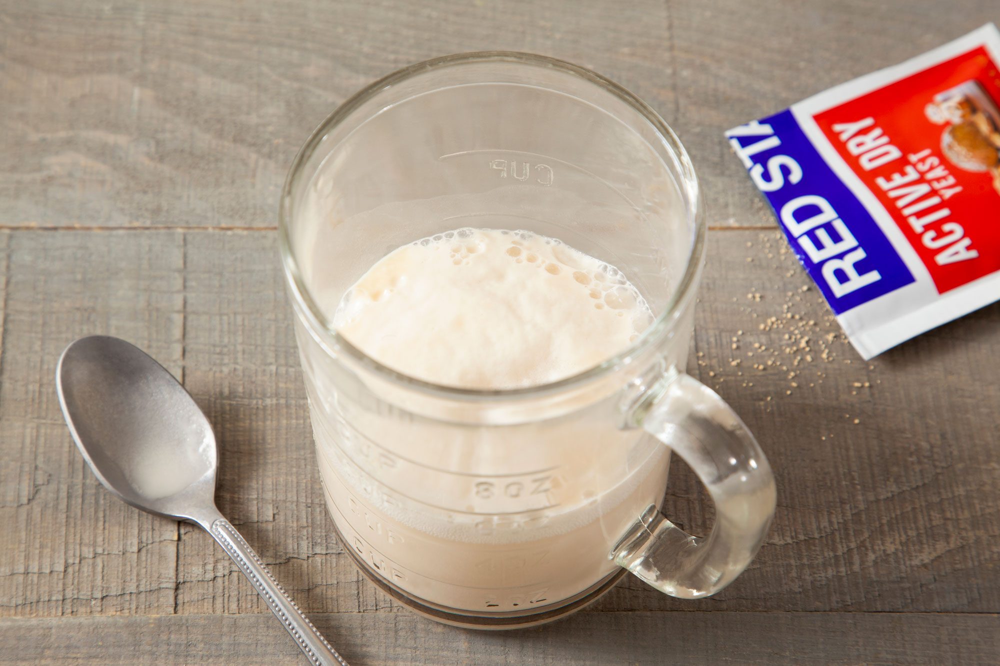 In a cup pour the yeast