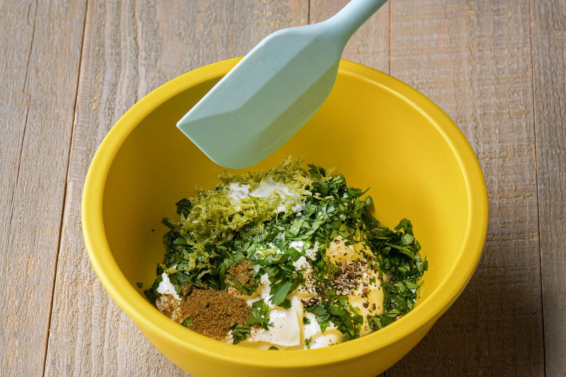 Mixing wet ingredients in smaller bowl